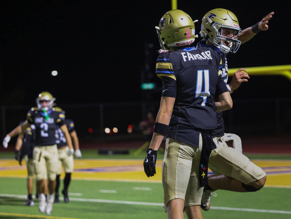 Foothill safety Brody Dobbs, right, celebrates with wide receiver Micah Farrar (4) after after ...