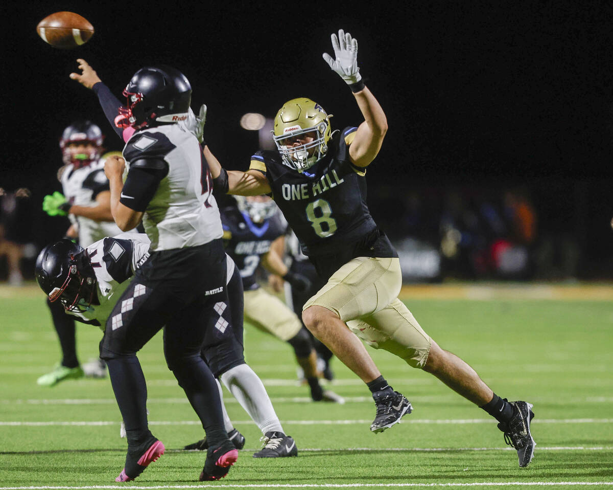Foothill defensive lineman Dallin Bair (8) puts pressure on Desert Oasis quarterback Vincent Ha ...