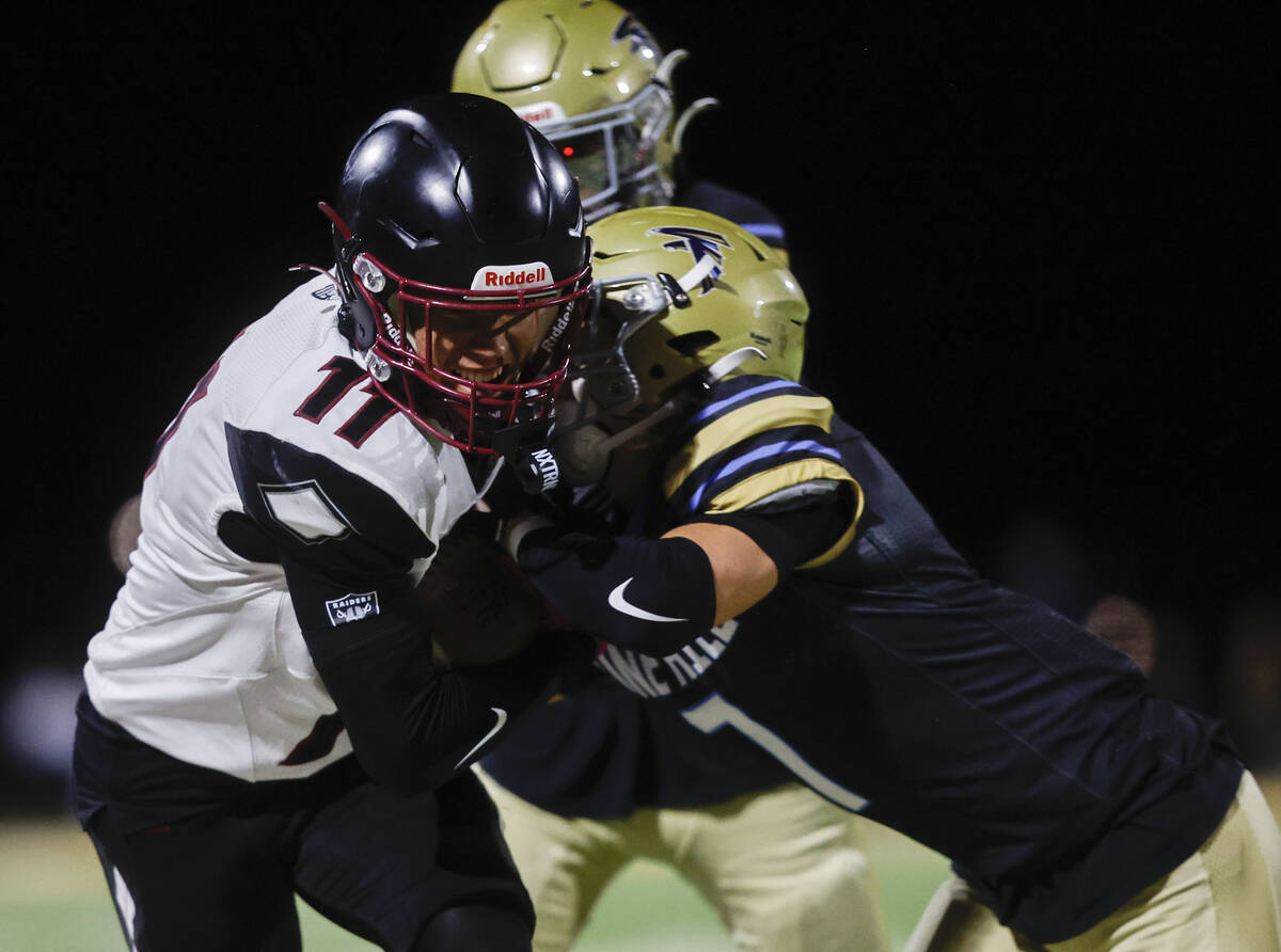 Desert Oasis wide receiver Holden Grobl (11) makes a catch and run before being tackled by Foot ...