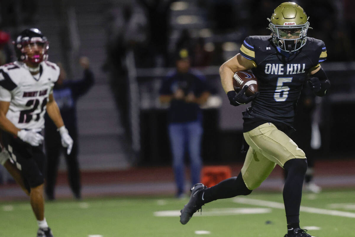 Foothill wide receiver Braxton Bonnett (5) makes the go-ahead touchdown catch and run past Dese ...