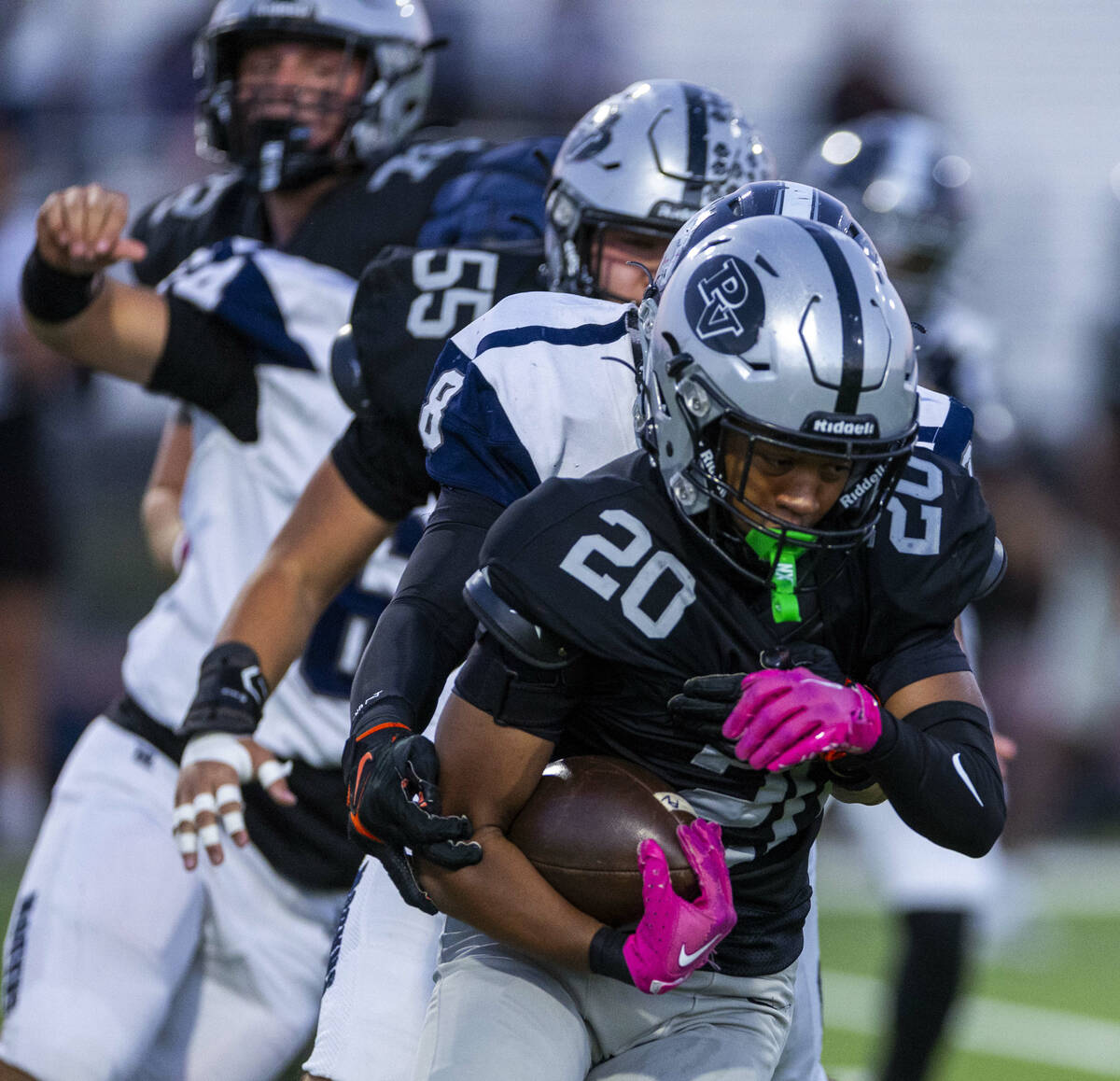 Palo Verde's Rio Pascal (20) attempts to get free from Shadow Ridge's Colton Richter ...