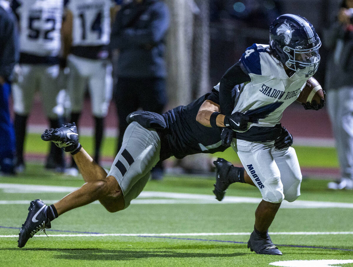 Shadow Ridge's Xavion Cross (4) is caught after a long gain by Palo Verde's Leo Templ ...