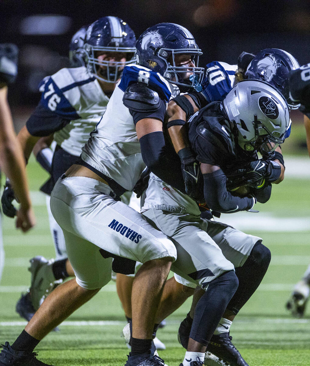 Shadow Ridge's Colton Richter (8) and Kawika Kalani (10) team up to drive back Palo Verde ...