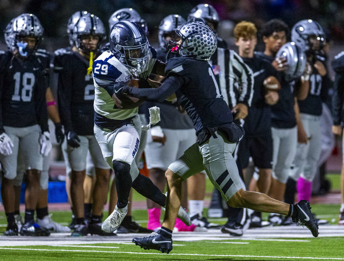 Shadow Ridge runner Trevin Young (29) is finally stopped by Palo Verde's Leo Templeton (1) ...