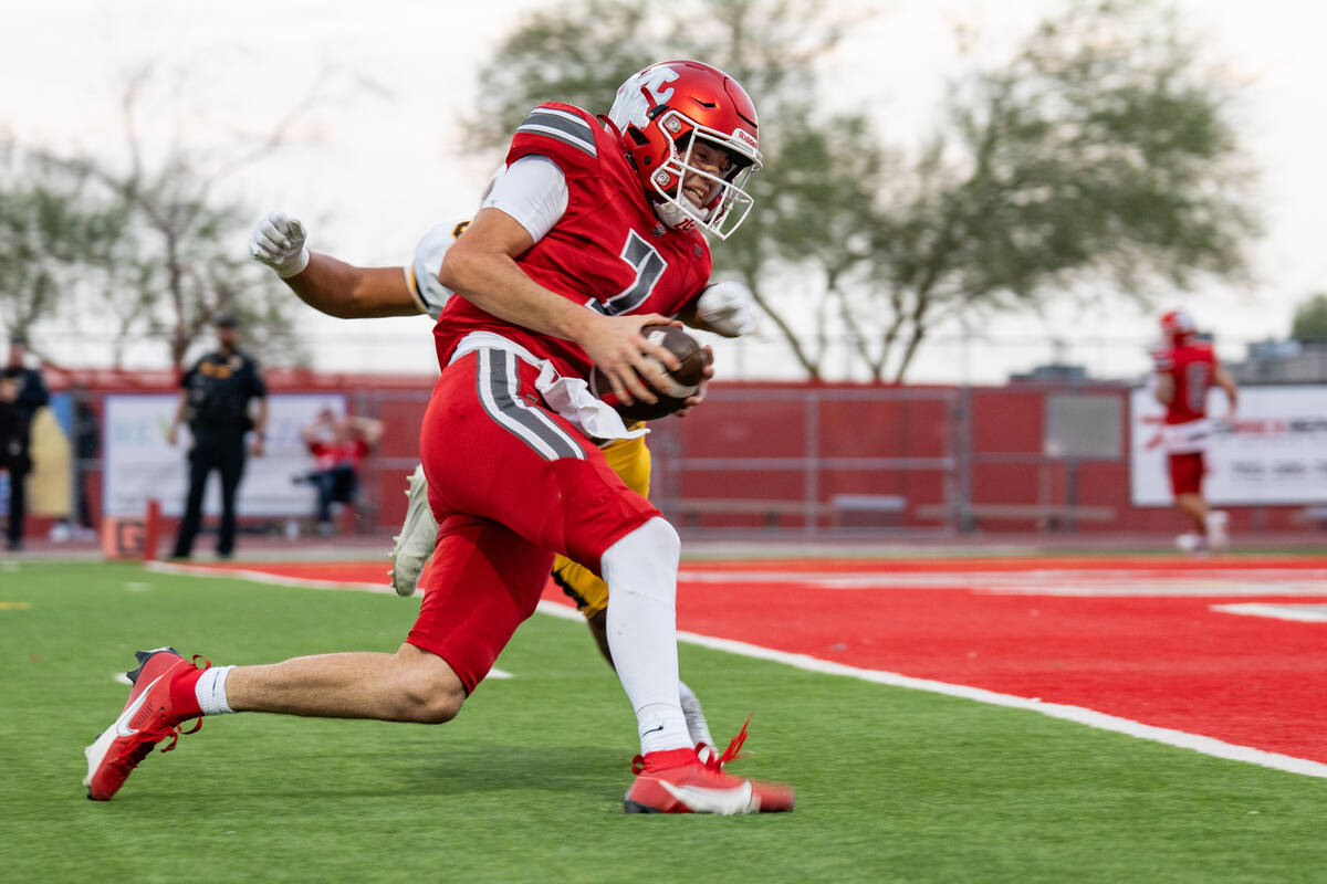 Arbor View Quarterback Thaddeus Thatcher (7) approaches the end zone during a football game bet ...