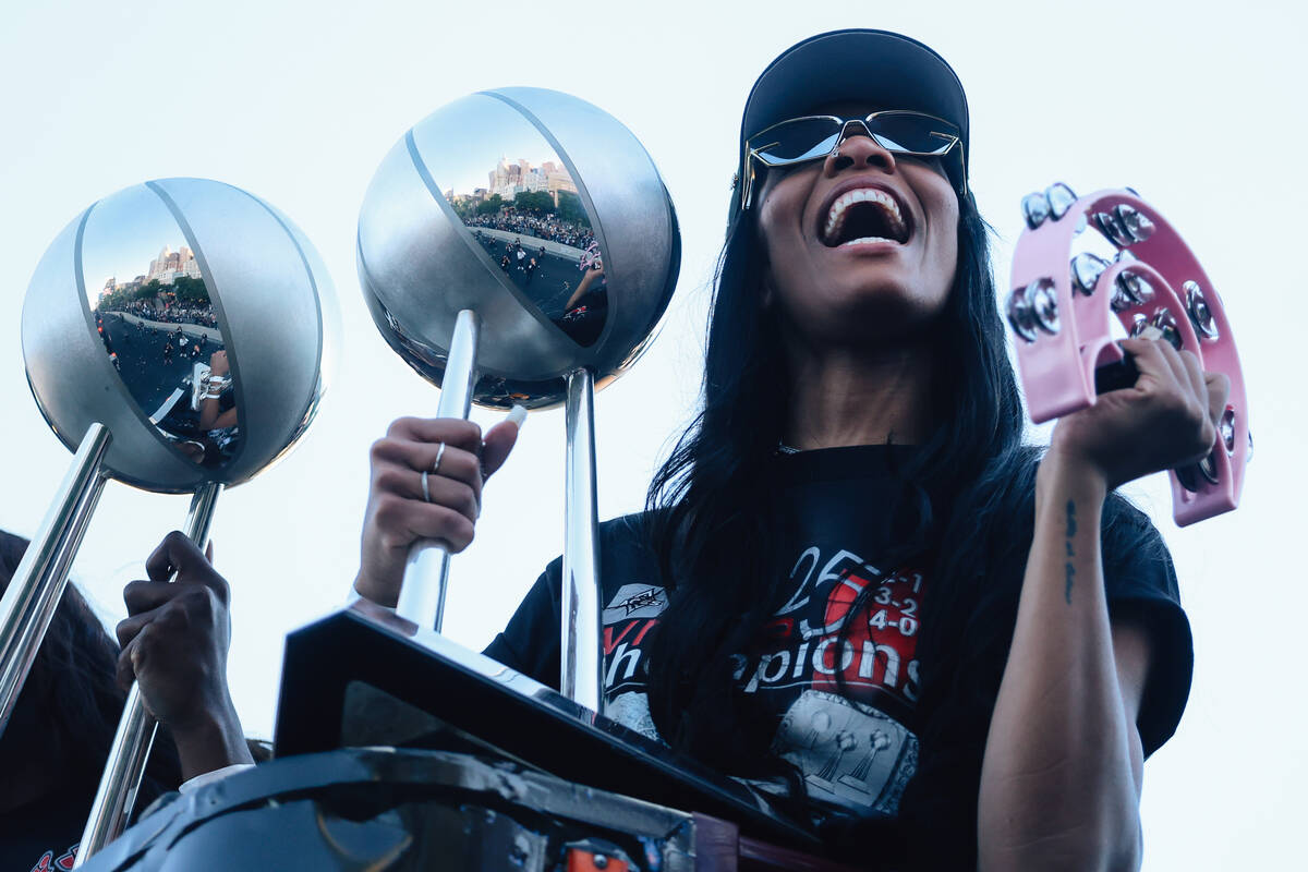 Aces center A'ja Wilson celebrates during the Aces’ championship parade on the Stri ...