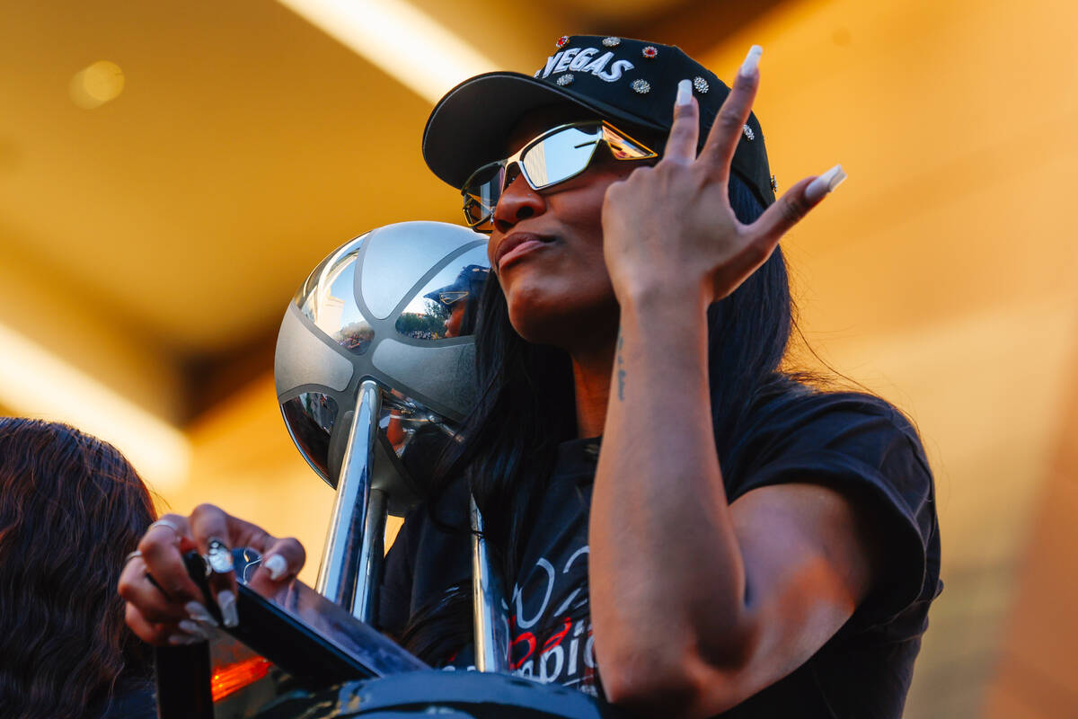 Aces center A'ja Wilson celebrates during the Aces’ championship parade on the Stri ...