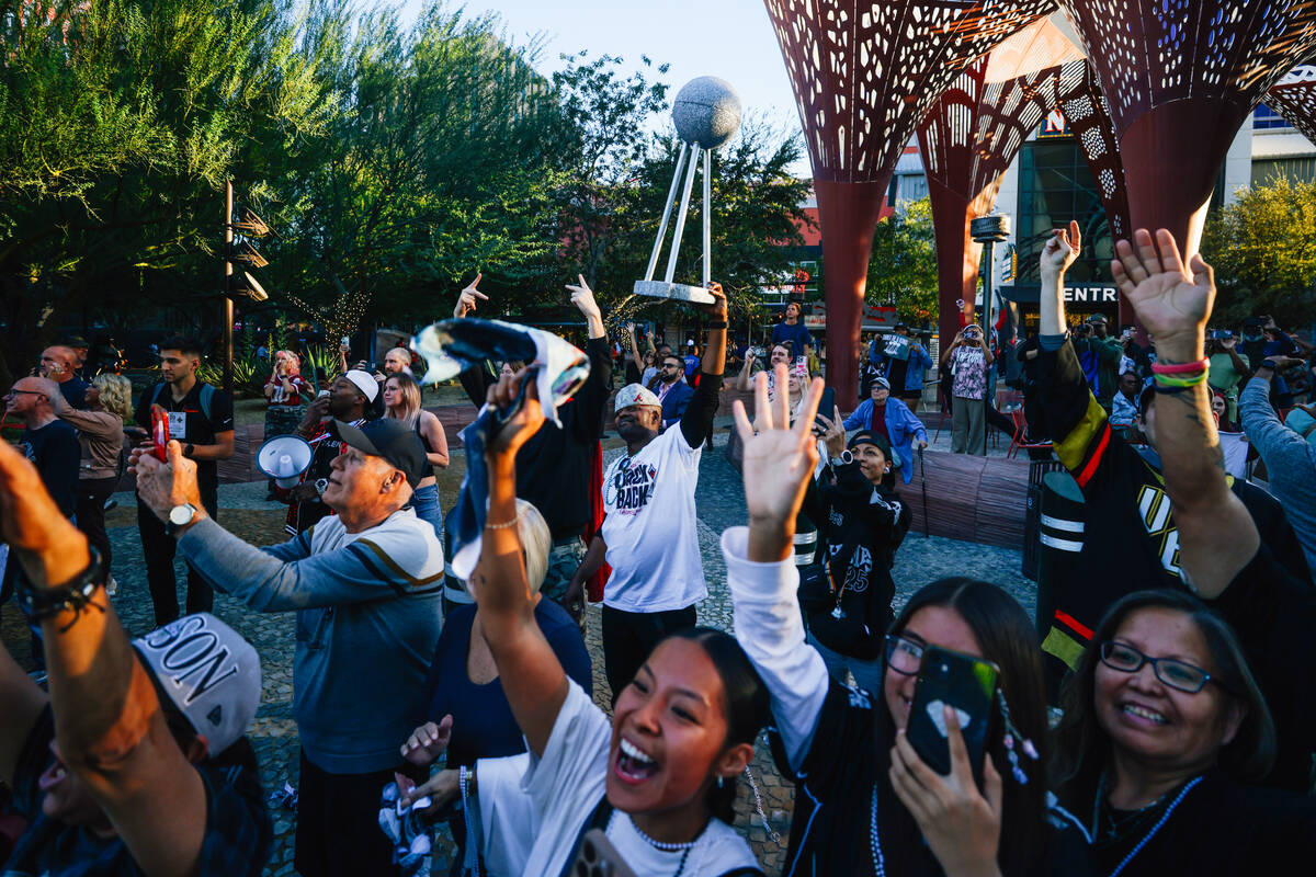 Fans celebrate during the Aces’ championship parade on the Strip Friday, Oct. 17, 2025, ...