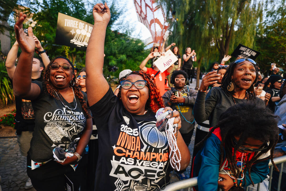 Fans celebrate during the Aces’ championship parade on the Strip Friday, Oct. 17, 2025, ...
