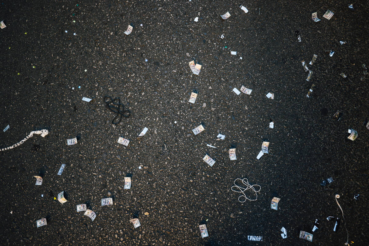 Confetti falls on the ground during the Aces’ championship parade on the Strip Friday, O ...