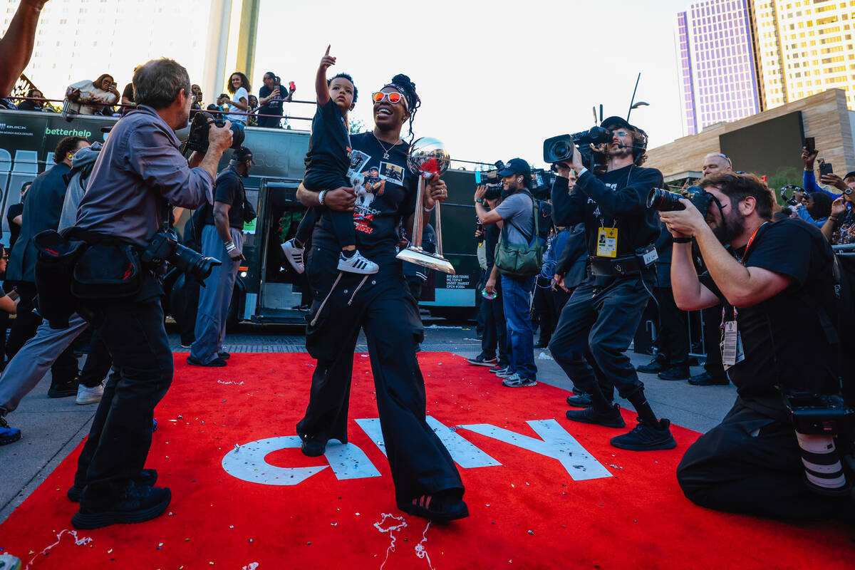 Aces guard Chelsea Gray walks the red carpet during the Aces’ championship parade on the ...