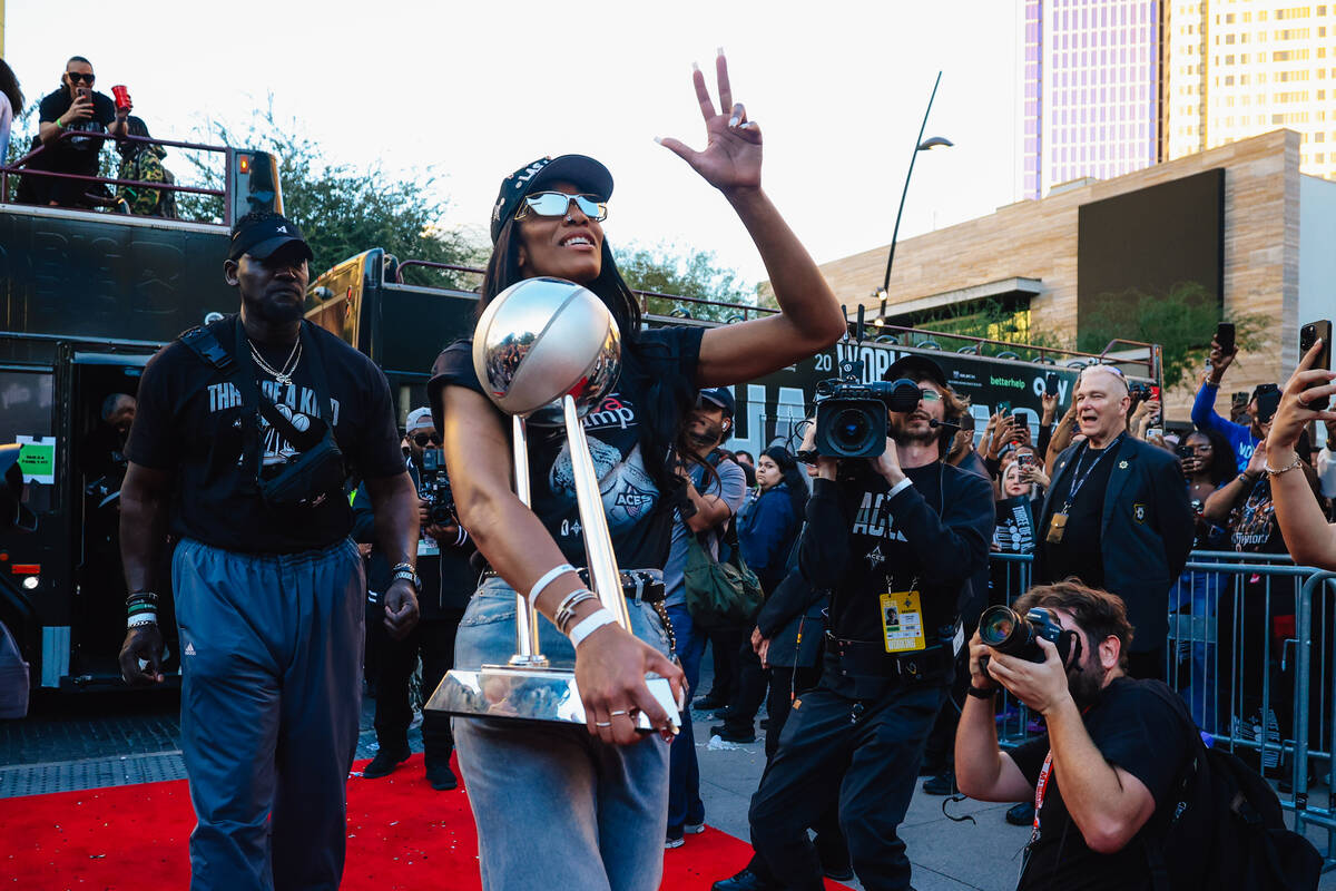 Aces center A'ja Wilson (22) walks the red carpet during the Aces’ championship par ...