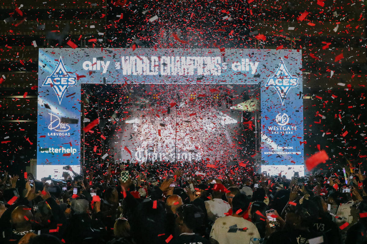 Confetti shaped like the WBNA Championship Trophy flutters over fans during the Aces’ ch ...