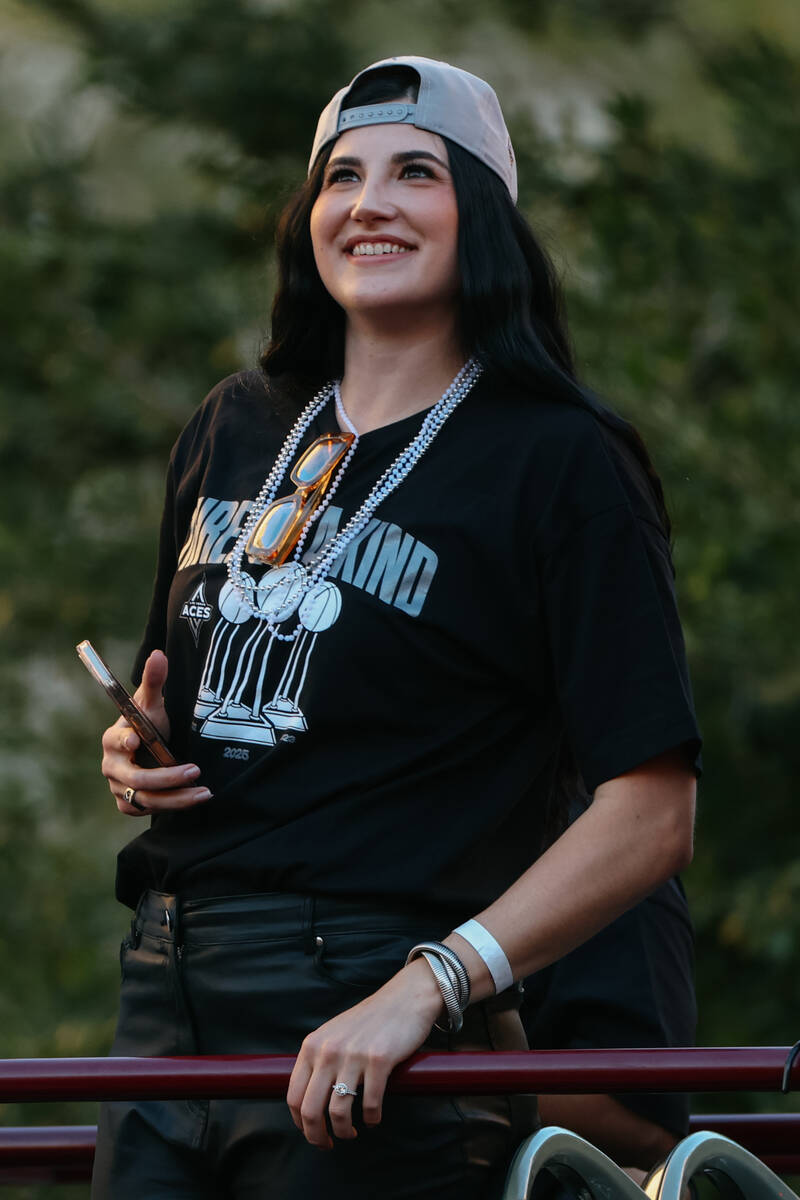 Aces center Megan Gustafson rides the parade bus during the Aces’ championship parade on ...