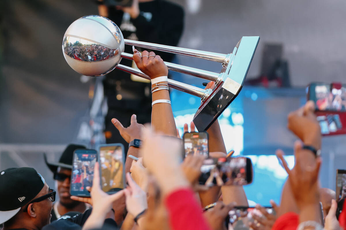 Ace center A’ja Wilson hoists up the WNBA Championship Trophy during the Aces’ ch ...