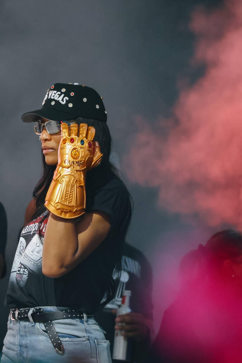 Aces center A’ja Wilson walks out onto the stage wearing a Marvel-themed glove during th ...