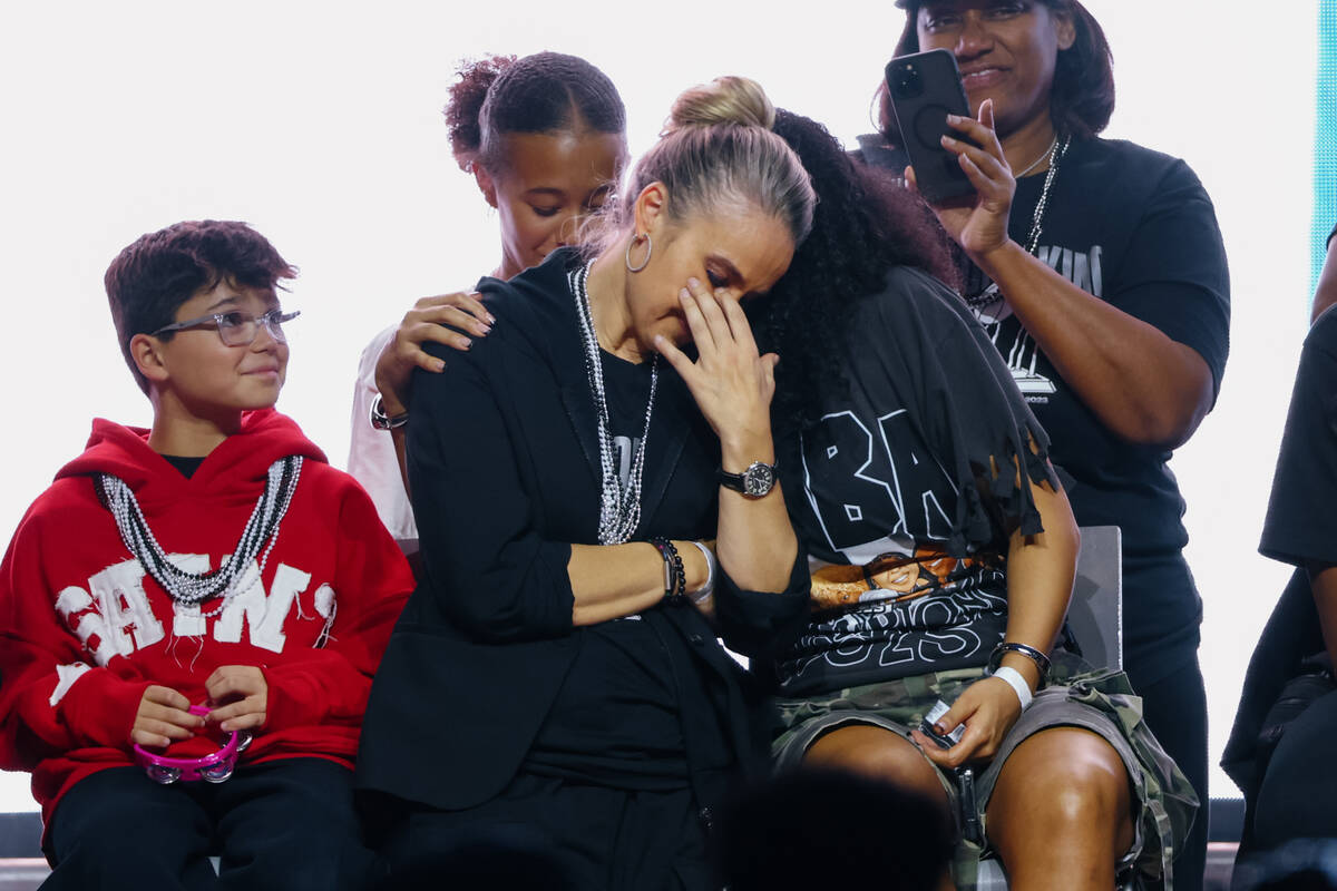 Ace player Aaliyah Nye comforts head coach Becky Hammon as Hammon becomes emotional at A&#x2019 ...