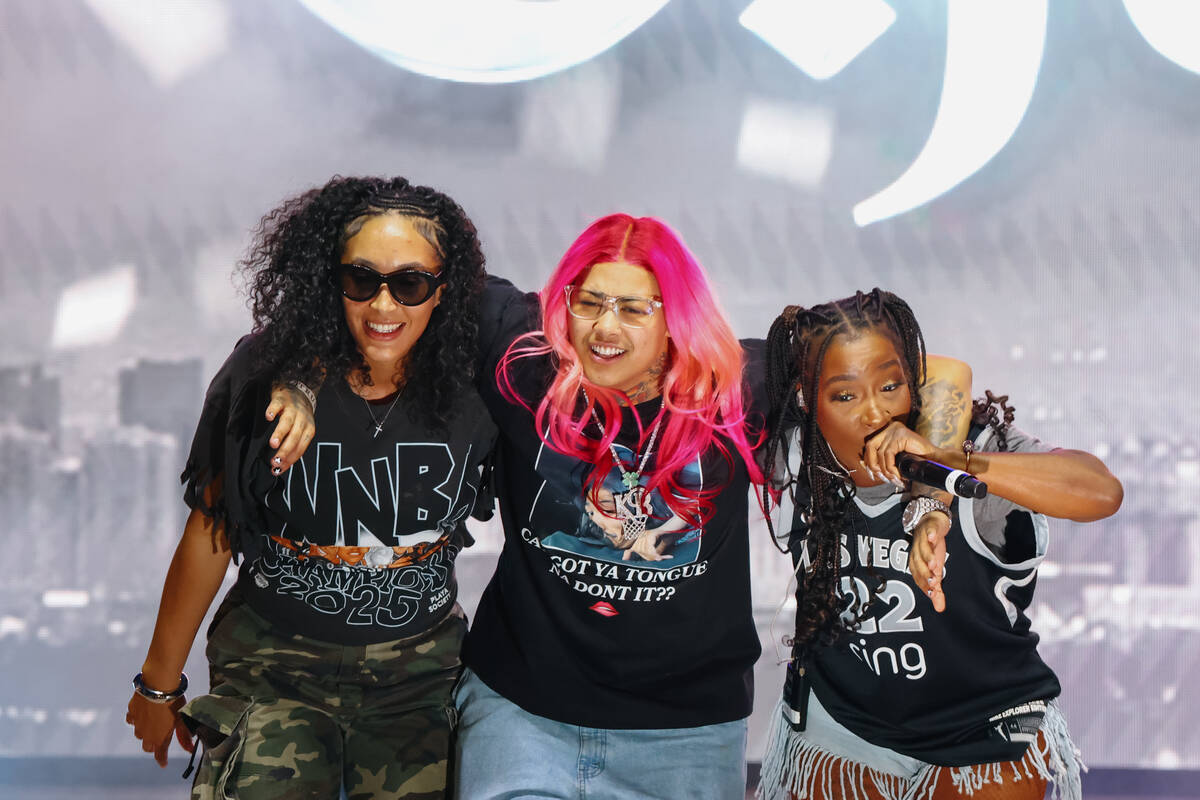 Aces players Aaliyah Nye and Kierstan Bell dance with Princess, of Crime Mob, during the Aces&# ...