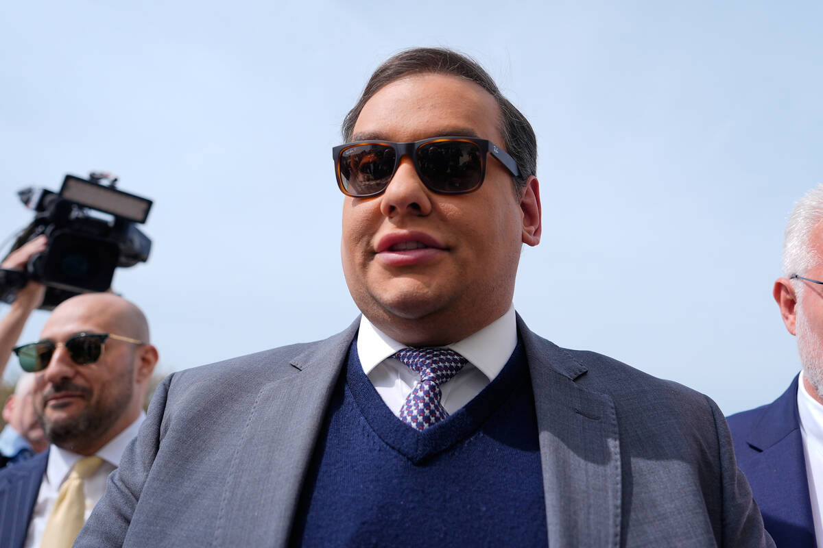 Former U.S. Rep. George Santos arrives at federal court for sentencing, April 25, 2025, in Cent ...