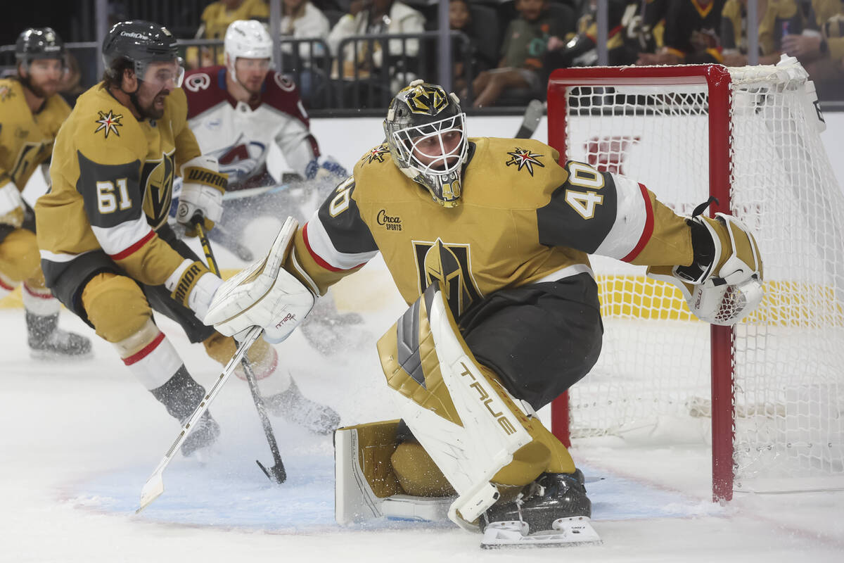 Golden Knights goaltender Akira Schmid (40) defends the net during the second period of an NHL ...