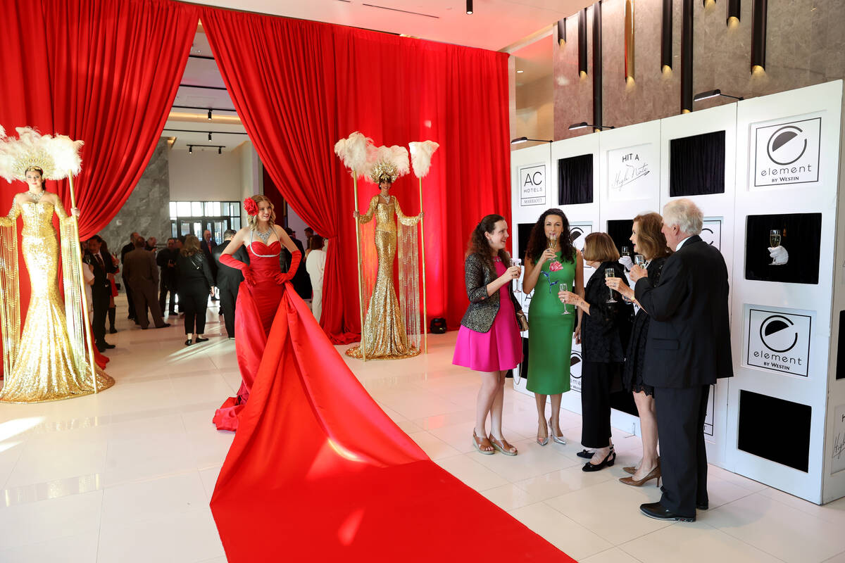 Guests mingle during the grand opening of the dual-branded AC Hotel by Marriott and Element by ...