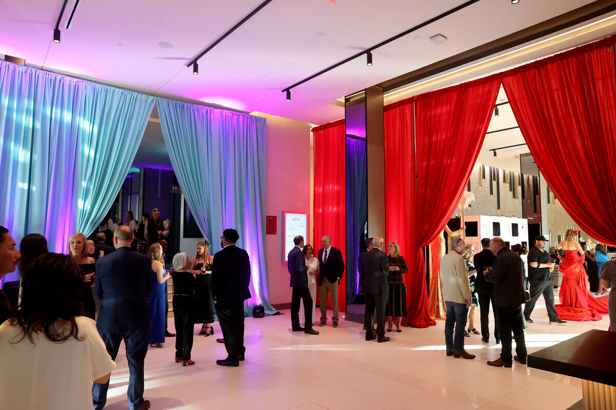 Guests mingle during the grand opening of the dual-branded AC Hotel by Marriott and Element by ...