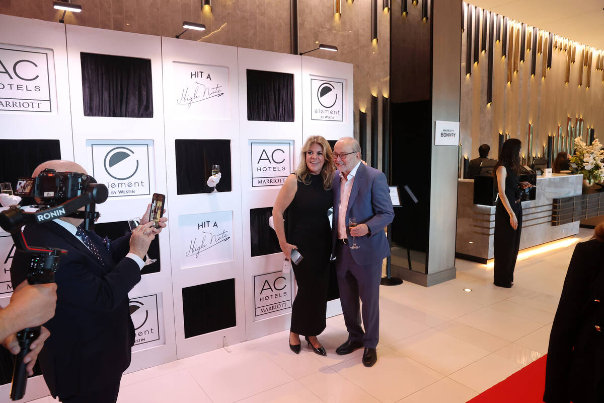 Director of Sales Malia Johnson poses with The Smith Center President and CEO Myron Martin duri ...