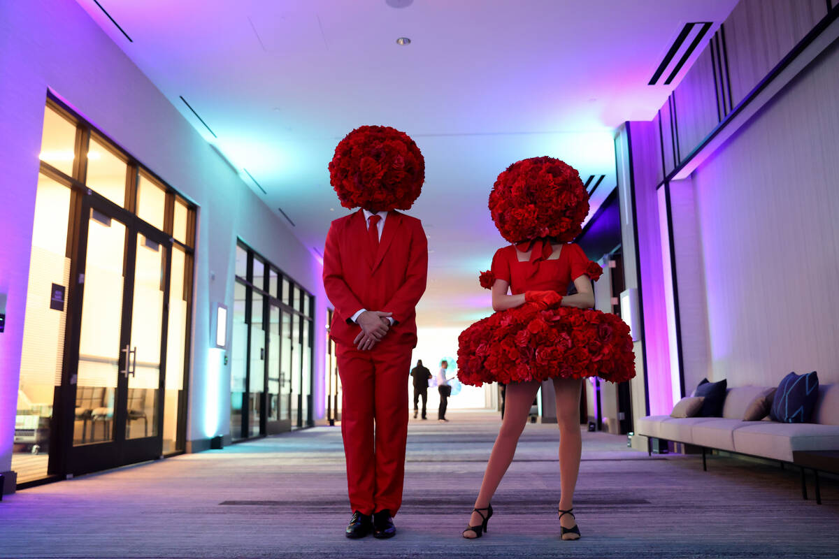 Models from Champagne Creative Group pose during the grand opening of the dual-branded AC Hotel ...
