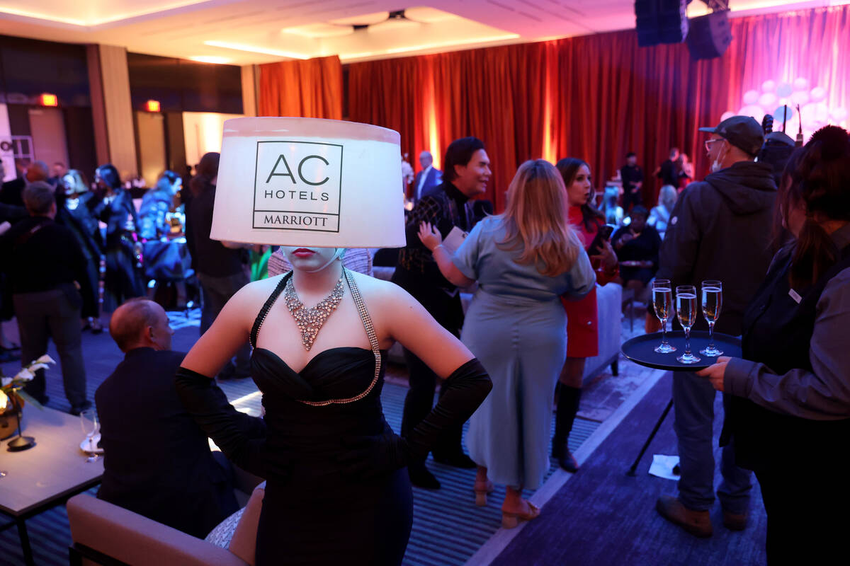 Abby Cork from Champagne Creative Group poses during the grand opening of the dual-branded AC H ...