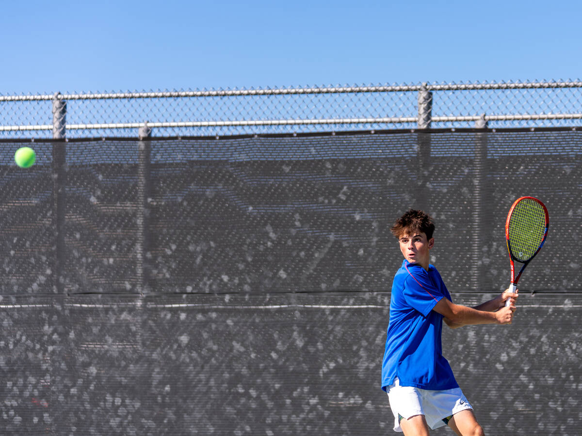 Bishop Gorman’s Lucas Rago returns the ball to Palo Verde’s Balin Gupta during th ...