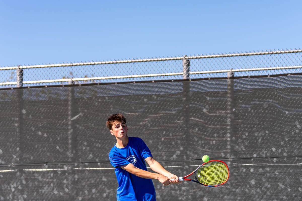 Bishop Gorman’s Lucas Rago returns the ball to Palo Verde’s Balin Gupta during th ...
