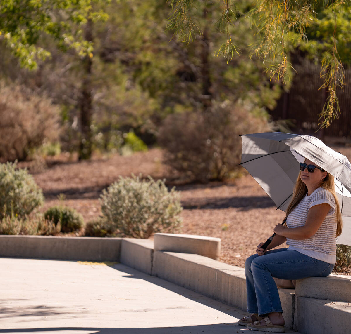 Spectators watch the 5A state singles and doubles title matches at Bishop Gorman High School in ...