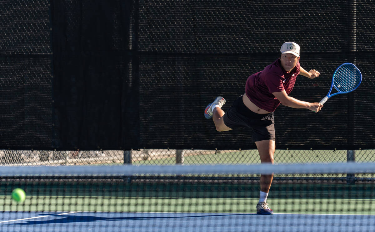 Faith Lutheran’s Huxley Banks returns the ball during the 5A state doubles title matches ...