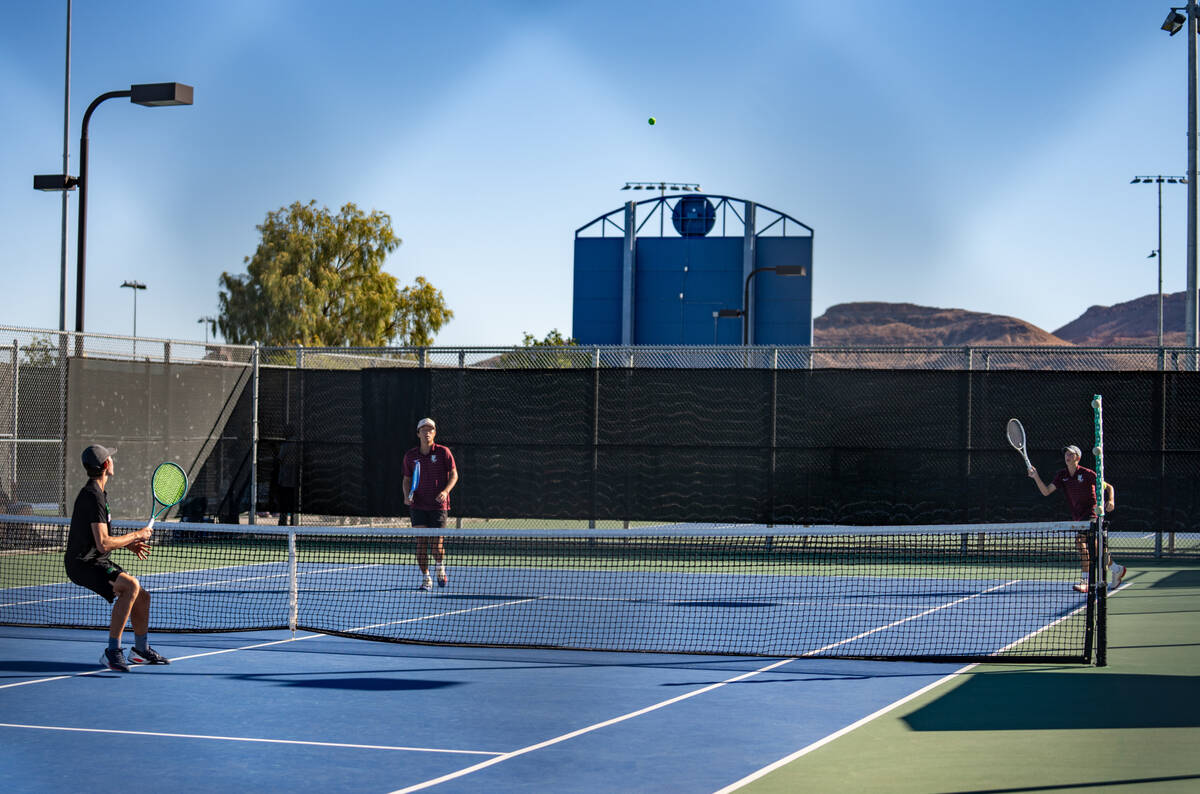 Faith Lutheran’s doubles partners Huxley Banks and Alpha Vongxaiburana return the ball d ...