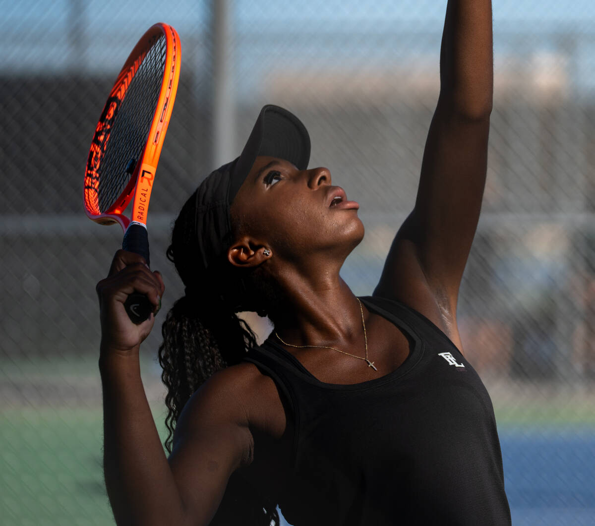Faith Lutheran’s Zoe Slusher’s serves the ball during the 5A state doubles title ...