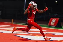 Liberty wide receiver Ameche Baldwin (7) celebrates a touchdown during a high school football g ...