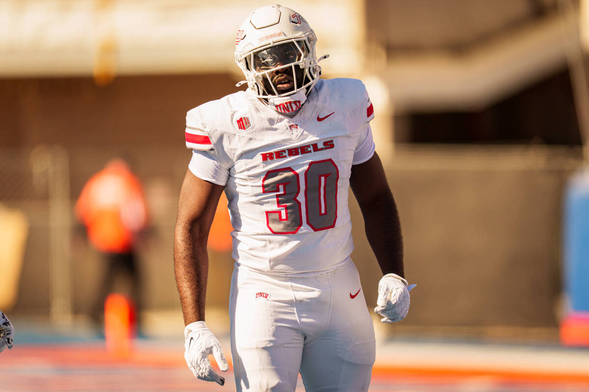 UNLV defensive end Tunmise Adeleye (30) takes a moment on the field during the game against Boi ...