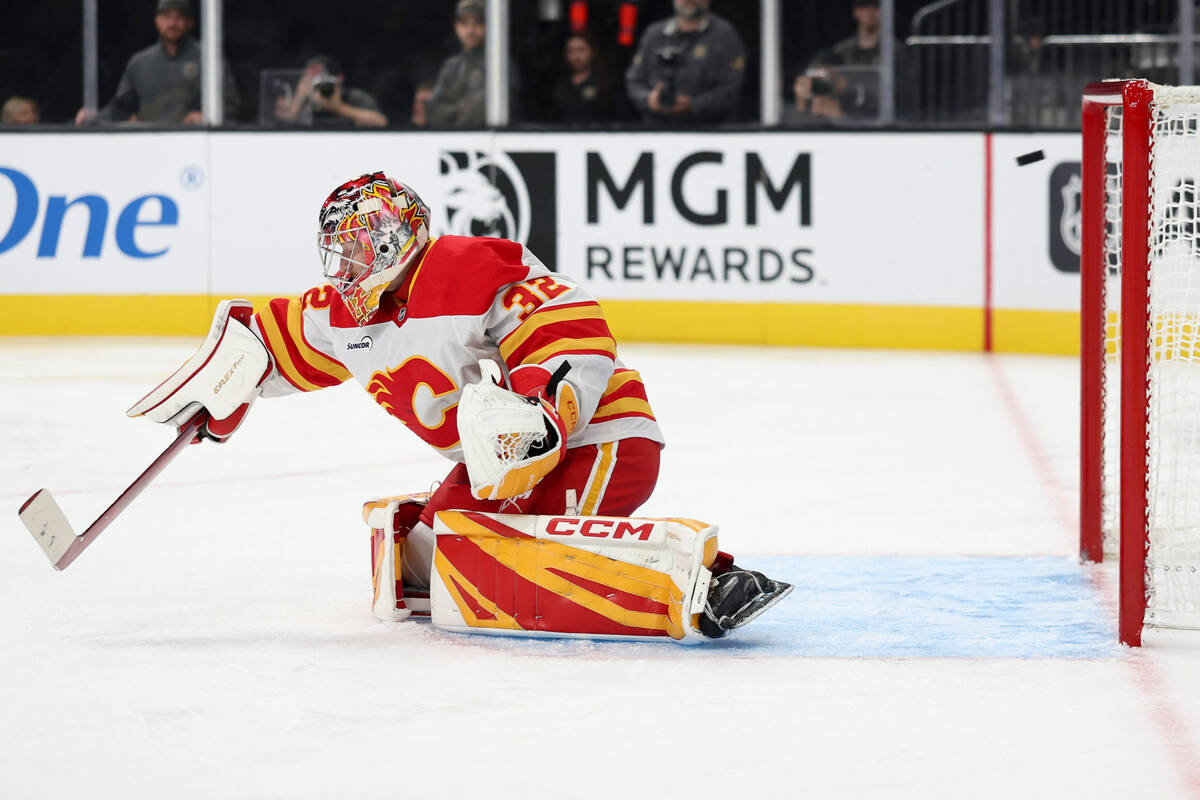 Calgary Flames goaltender Dustin Wolf (32) allows a goal against the Vegas Golden Knights durin ...