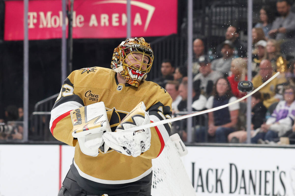 Vegas Golden Knights goaltender Adin Hill (33) deflects a puck during the third period of an NH ...