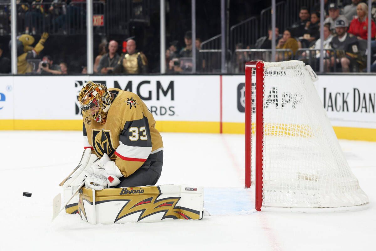 Vegas Golden Knights goaltender Adin Hill makes a save against the Calgary Flames during the fi ...