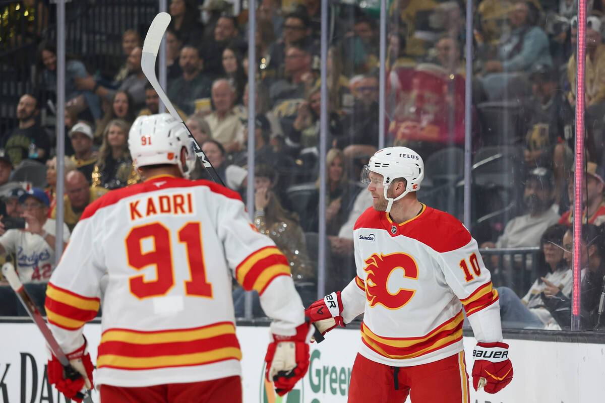 Calgary Flames left wing Jonathan Huberdeau (10) reacts after scoring against the Vegas Golden ...