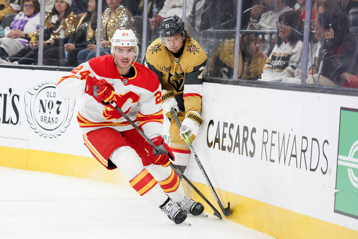 Vegas Golden Knights center William Karlsson (71) runs into the boards while skating against Ca ...