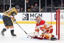 Vegas Golden Knights right wing Mitch Marner (93) scores a goal past Calgary Flames goaltender ...