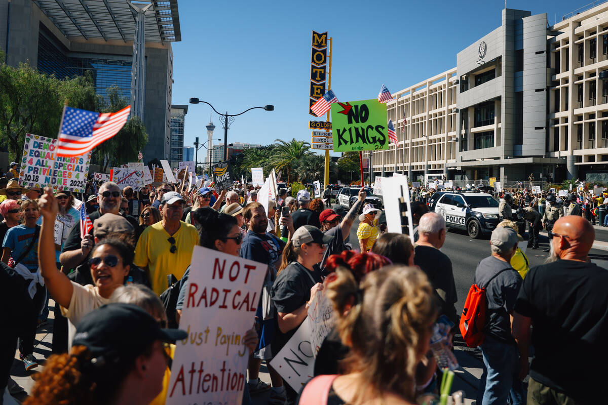 Demonstrators gather for for the "No Kings” protest outside the Lloyd D. George U.S. Courthou ...