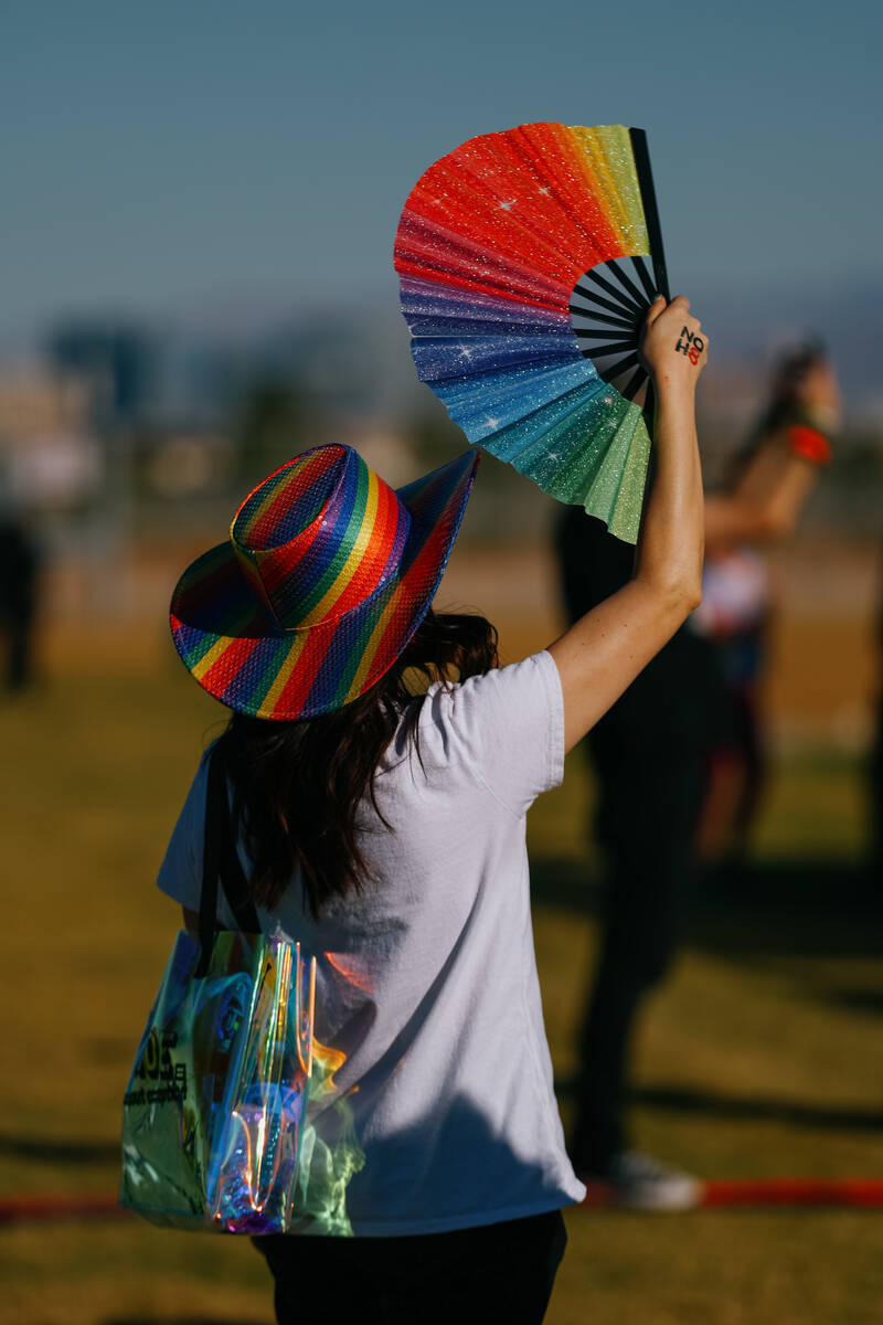 An attendee waves a rainbow fan during the Las Vegas PRIDE Festival on Saturday, Oct. 18, 2025 ...