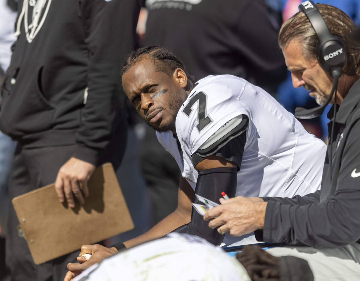 Raiders quarterback Geno Smith (7) looks pensive on the sideline during the first half of an NF ...