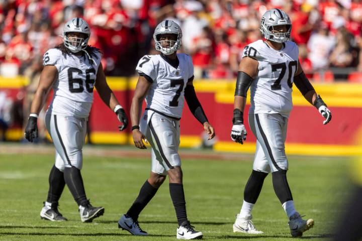 Raiders guard Dylan Parham (66), quarterback Geno Smith (7) and offensive tackle Stone Forsythe ...