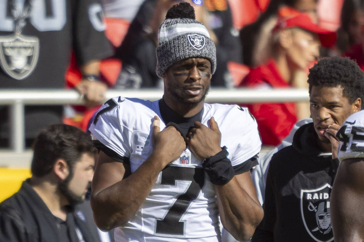 Raiders quarterback Geno Smith (7) watches the team play the Kansas City Chiefs from the sideli ...