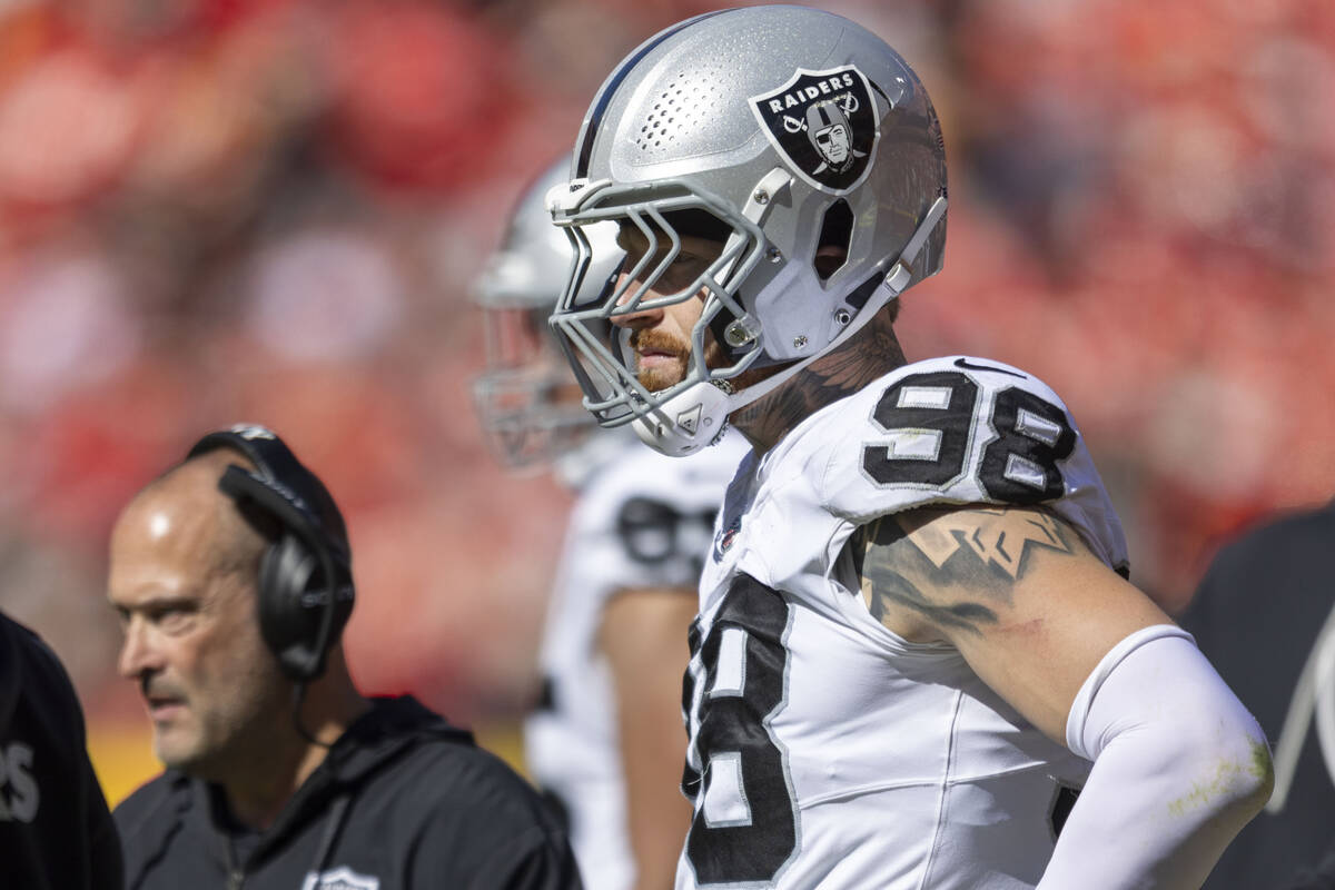 Raiders defensive end Maxx Crosby (98) watches the team play the Kansas City Chiefs from the si ...