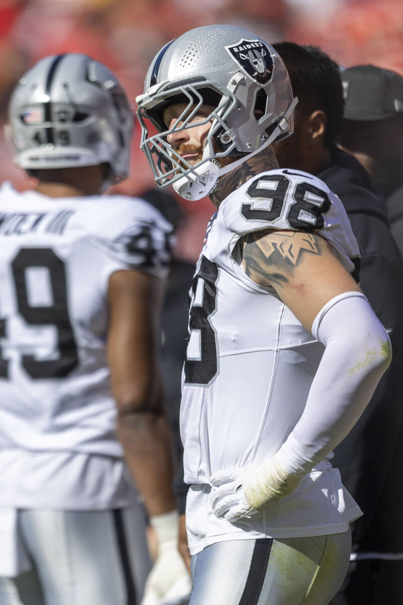 Raiders defensive end Maxx Crosby (98) watches the team play the Kansas City Chiefs from the si ...